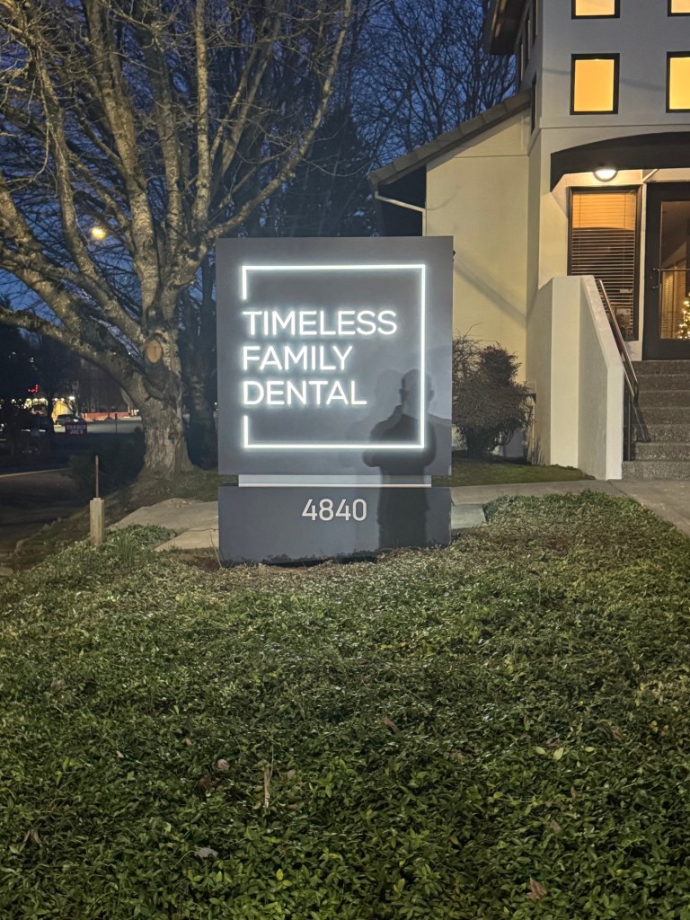 Illuminated “Timeless Family Dental” sign with address 4840.